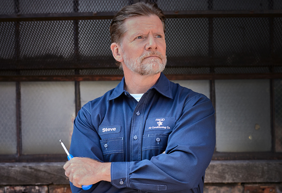 Worker in branded work shirt